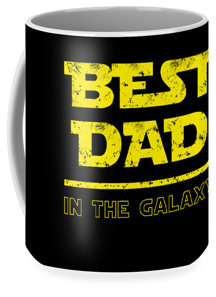 Black mug with yellow 'BEST DAD' text and 'IN THE GALAXY' line