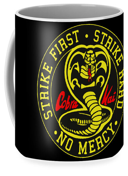 Black mug with yellow cobra emblem and 'NO MERCY' text