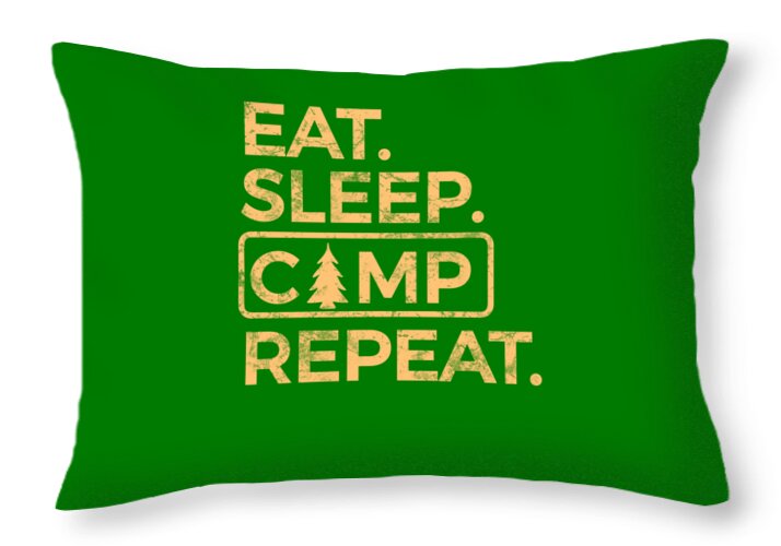 Green throw pillow with Eat Sleep Camp Repeat graphic in light lettering