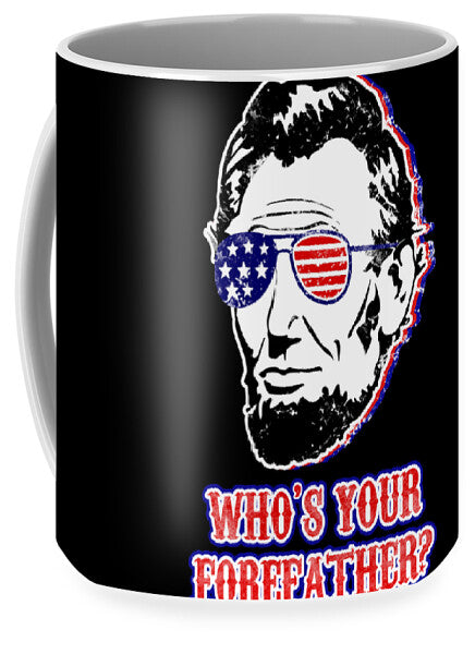 Black coffee mug with centered Abe Lincoln face, flag glasses, and 'WHO'S YOUR FOREFAATHER?'