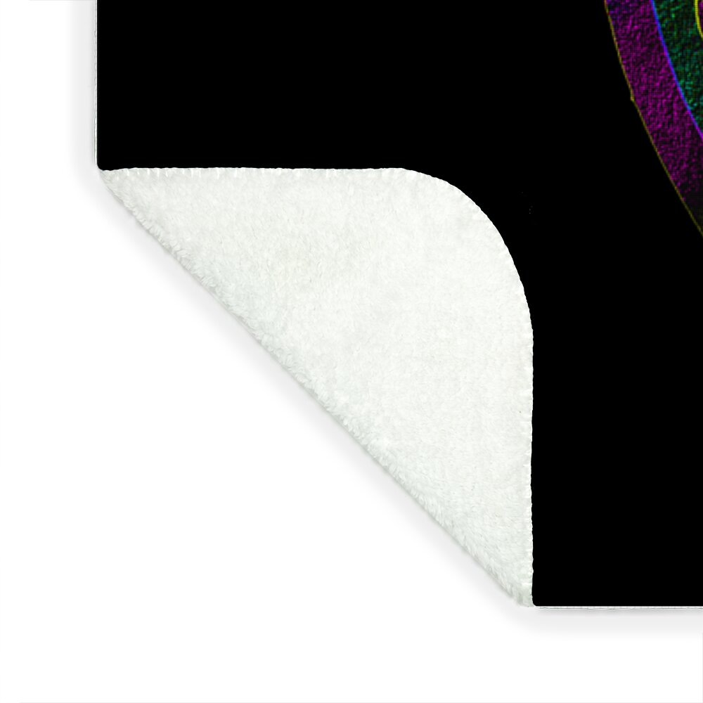 Blanket corner with white plush underside and black top border, rounded edge.