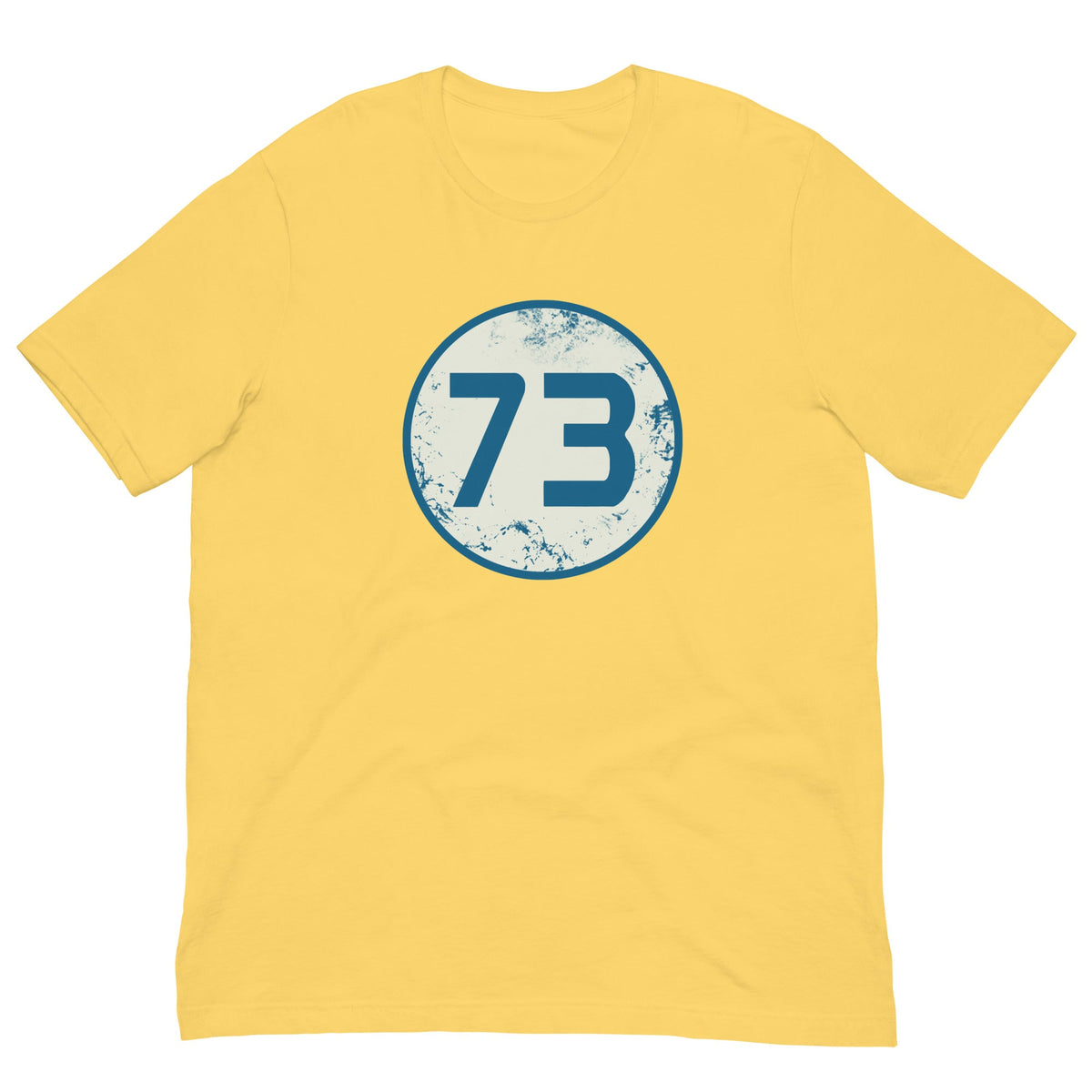 Yellow T-shirt with circular “73” graphic on the chest.