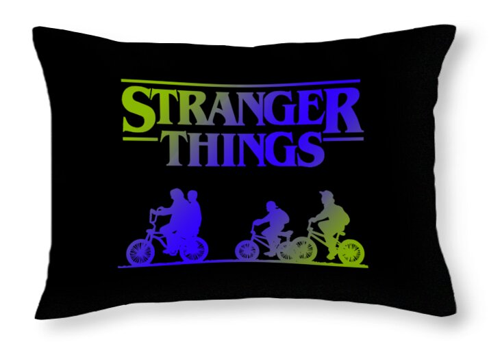 Rectangular black throw pillow featuring Stranger Things text and bike riders
