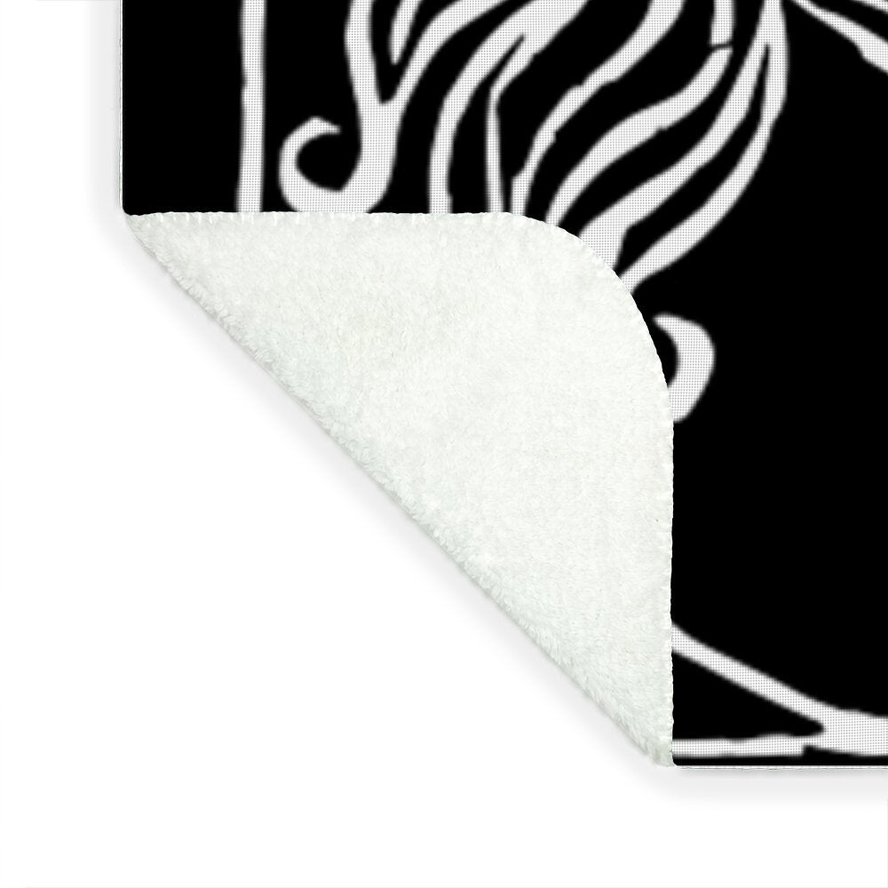 Dracula woodcut blanket corner, white plush reverse visible on folded edge