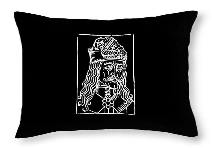 Black throw pillow with white rectangular woodcut graphic of a crowned figure