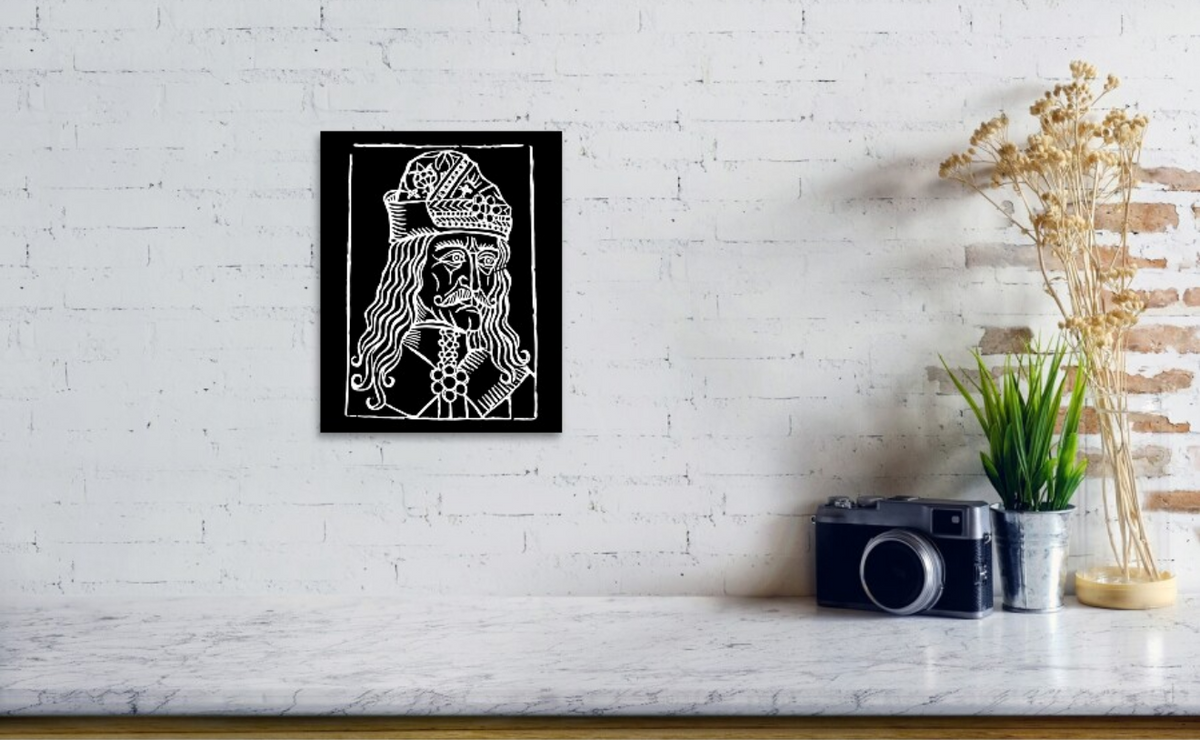 Framed black-and-white woodcut Dracula portrait with ornate headpiece and flowing hair lines.