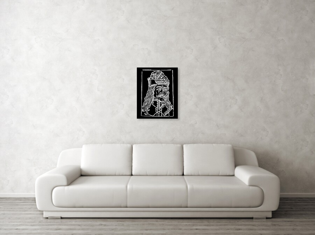 Framed black-and-white woodcut Dracula portrait centered on wall, ornate crown and beard.