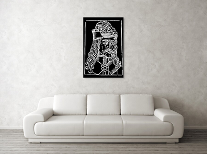 Framed black-and-white woodcut Dracula portrait with ornate crown and layered ruffle at chest.