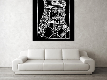 Close view of framed black-and-white woodcut Dracula portrait with ornate crown and eyes.