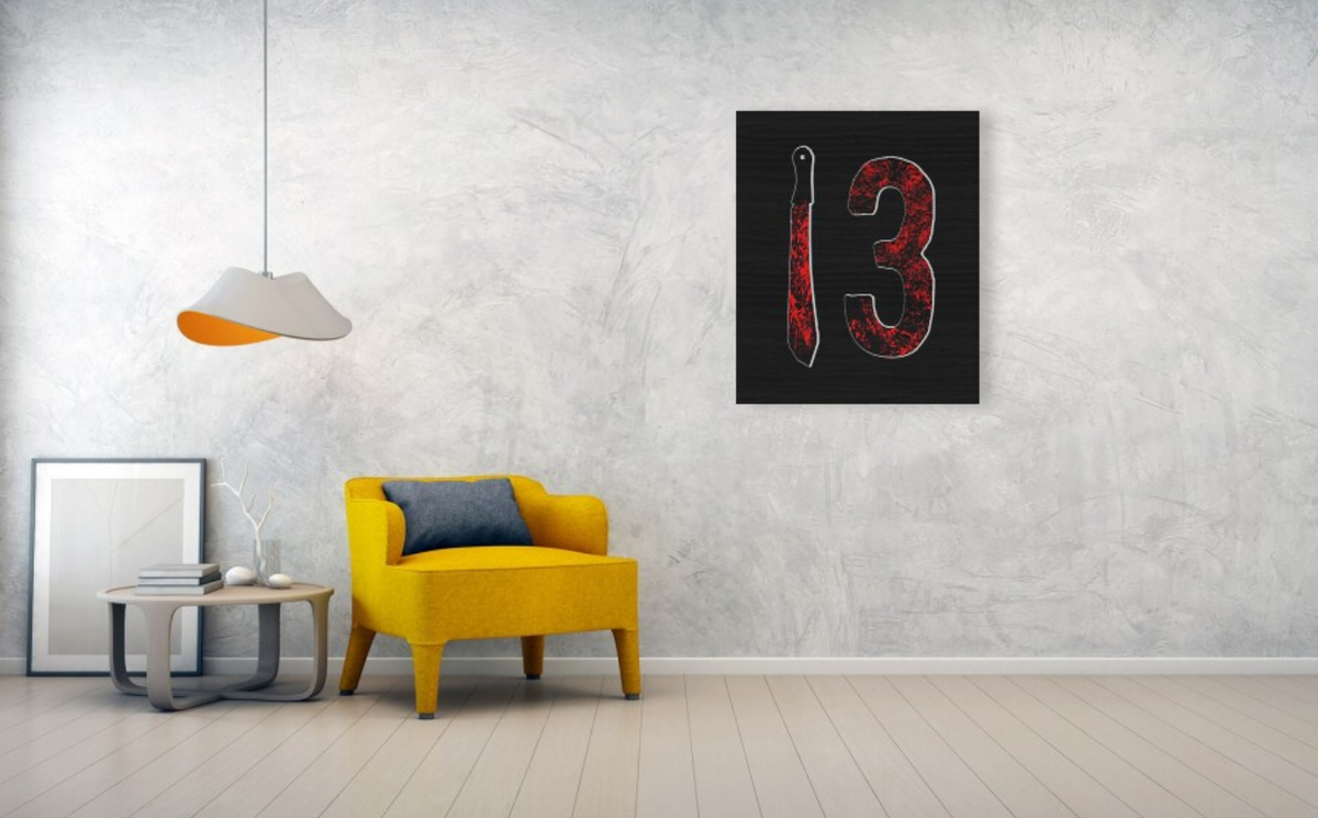 Wood print featuring red-splatter number 13 and machete silhouette, centered composition.