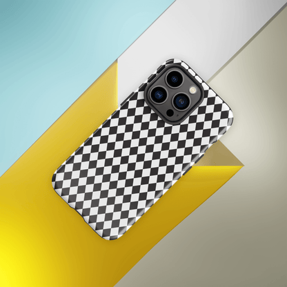 Protective iPhone case with black and white diamond pattern, camera cutouts, angled view from above
