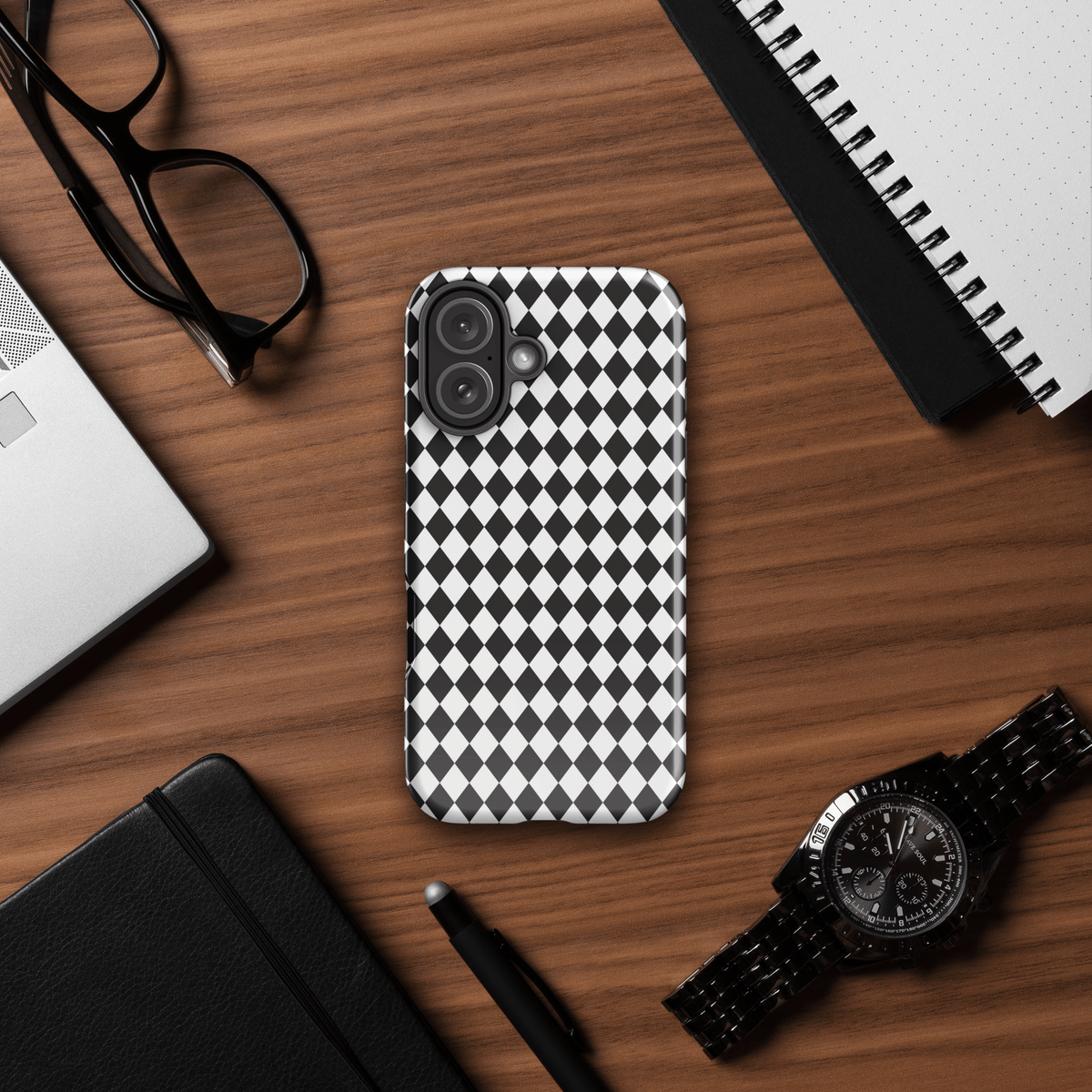 Tough iPhone case with black-and-white diamond check pattern and raised camera edges