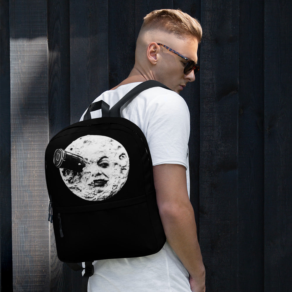 Black backpack with moon face graphic, side view with adjustable shoulder straps