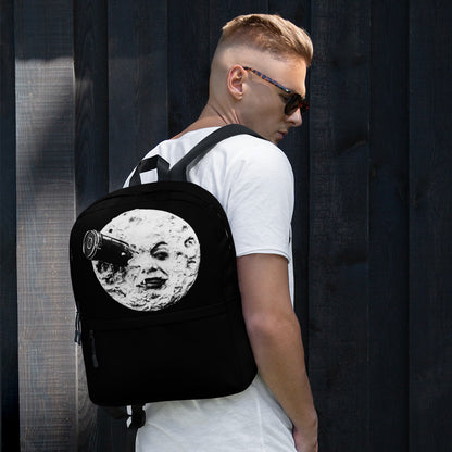 Black backpack with moon face graphic, side view with adjustable shoulder straps