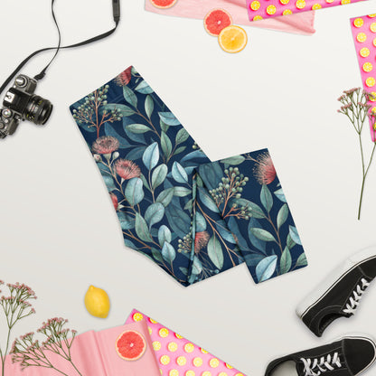 Botanical capri leggings with dark navy base, teal foliage, and pink floral print