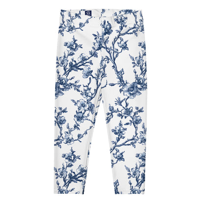 White capri leggings with blue floral vine print, front view.