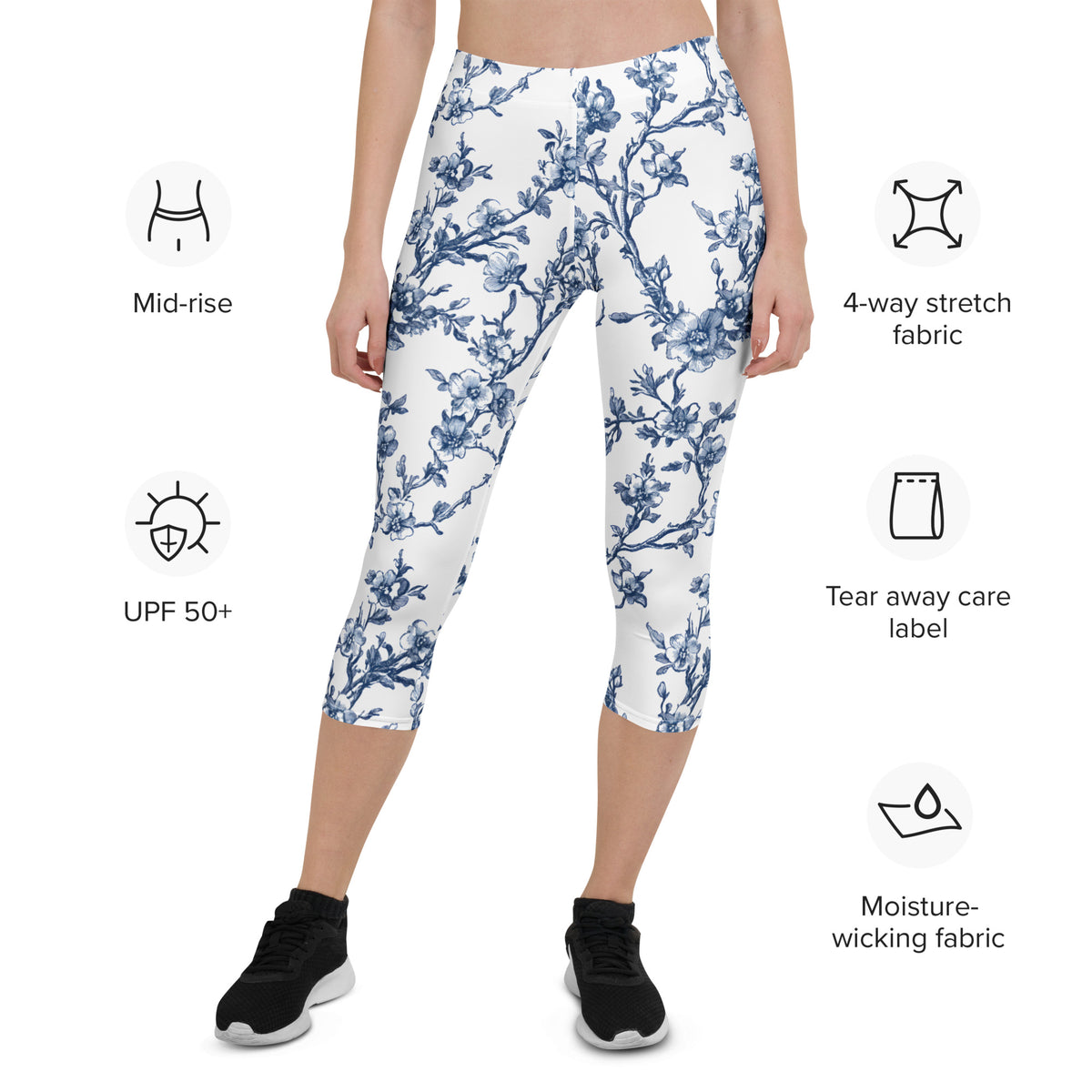 White capri leggings with blue floral print, mid-rise, mid-calf length.