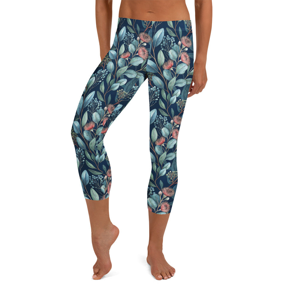 Botanical capri leggings in dark navy with teal foliage and pink floral accents