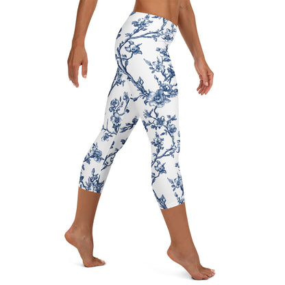White capri leggings with blue floral vine print, full-leg view