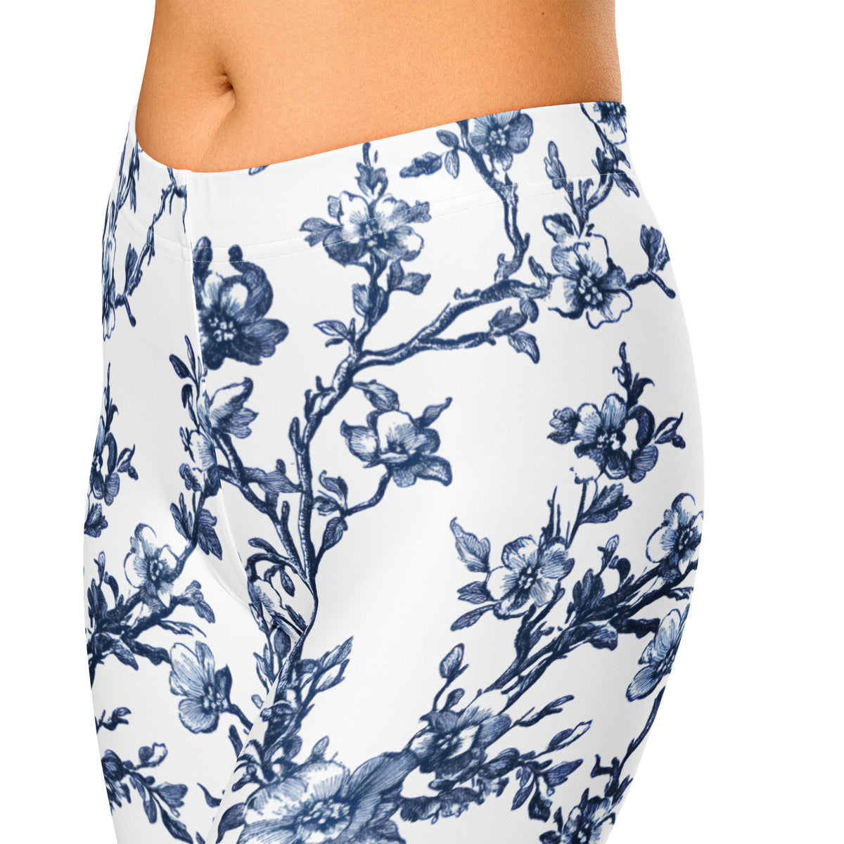 Back of white capri leggings with blue floral vine and flower print.