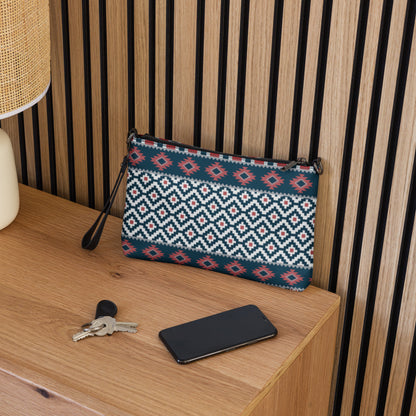 Aztec-pattern crossbody bag on tabletop with keys and phone nearby; blue-red-white print