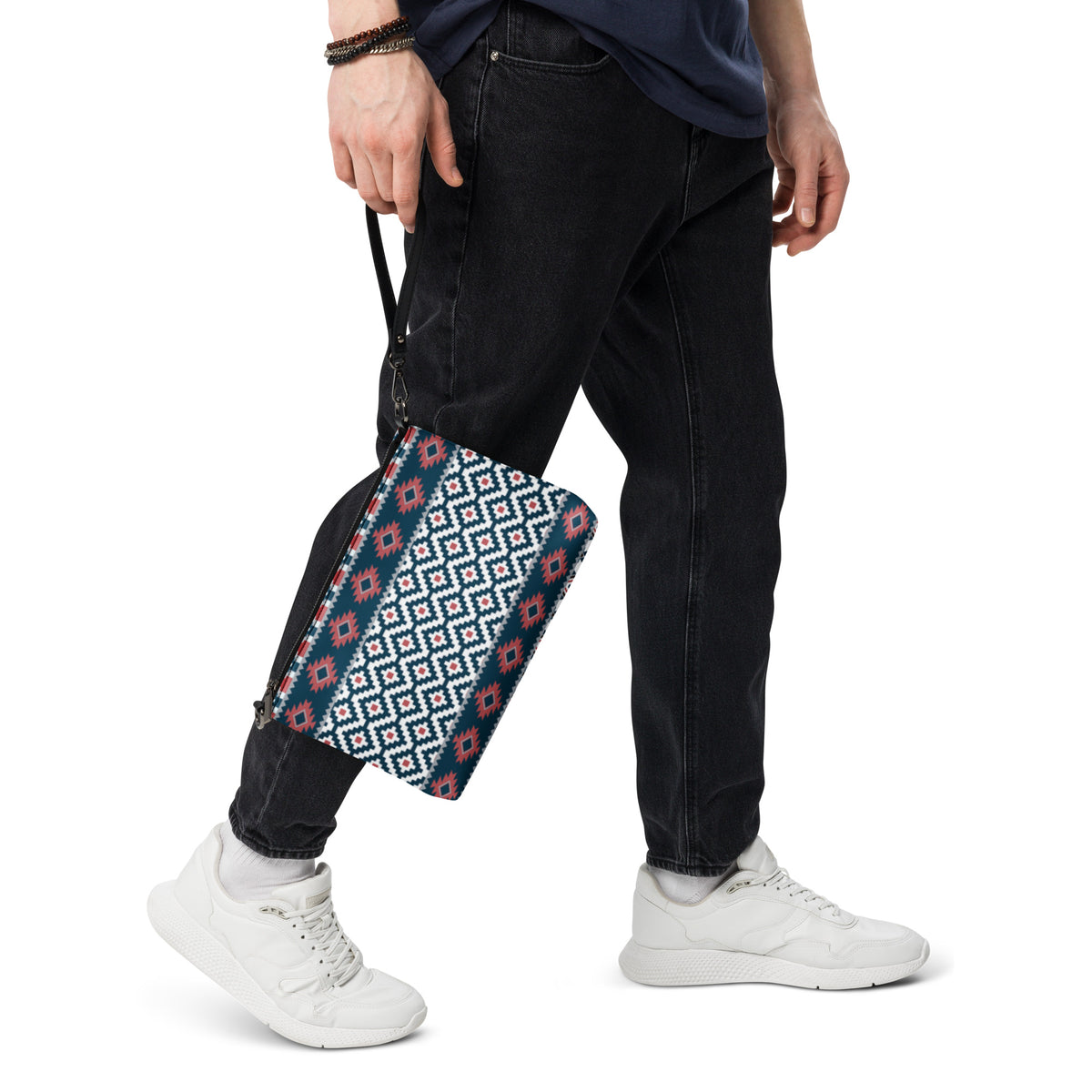 Geometric patterned crossbody bag with black zipper and crossbody strap, side view