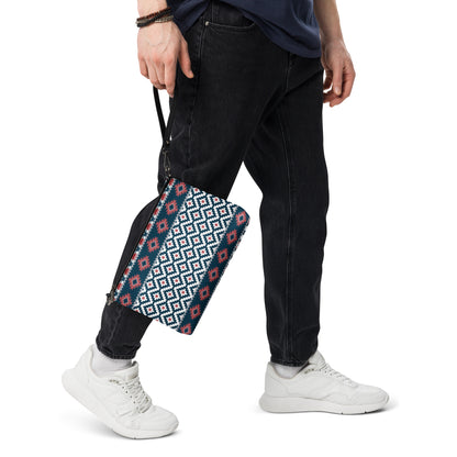 Geometric patterned crossbody bag with black zipper and crossbody strap, side view