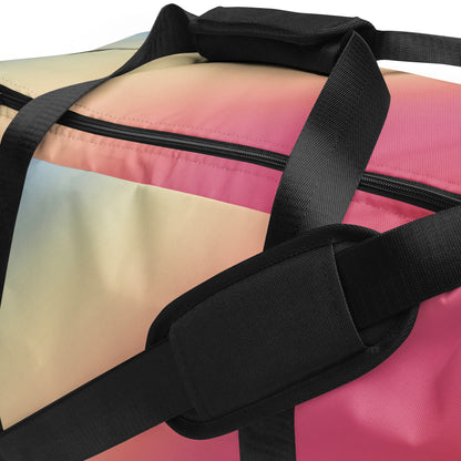 Gradient duffle bag close-up with black zipper and mesh panel, blue to pink striped fabric
