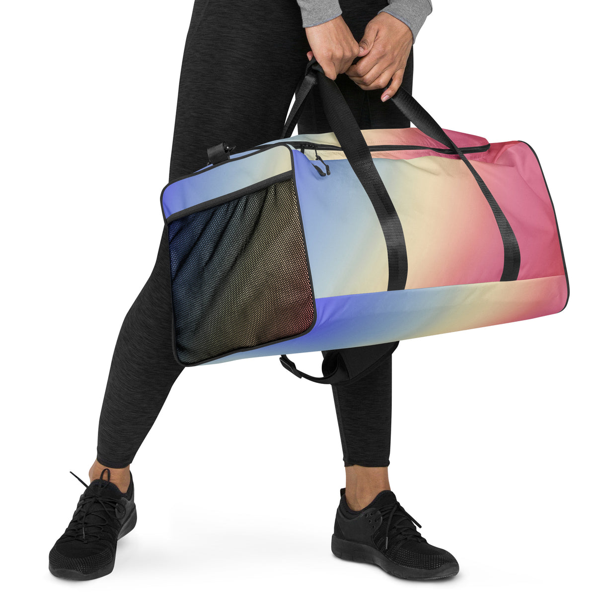 Gradient duffle bag held by black handles, side mesh pocket and blue to pink stripes