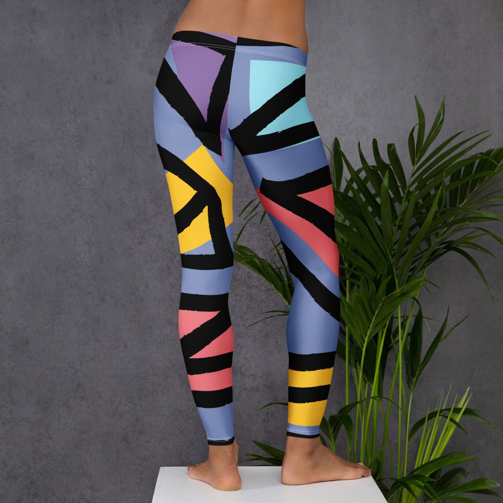 Geometric pattern leggings with blue, black, yellow, purple, and pink angular sections.