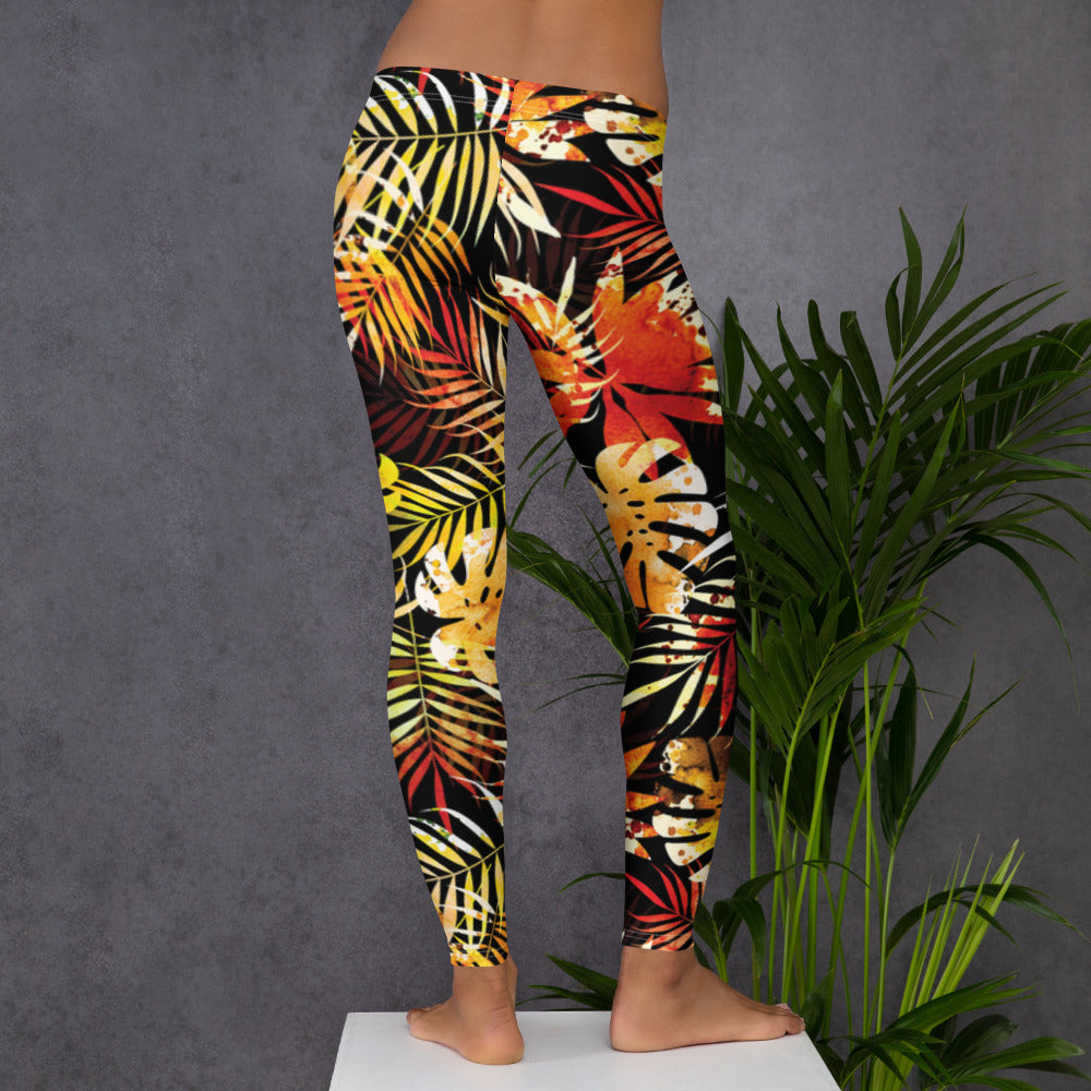 Women's tropical leaf print leggings, side view with yellow red green leaf pattern