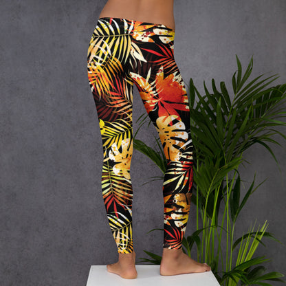 Women's tropical leaf print leggings, side view with yellow red green leaf pattern