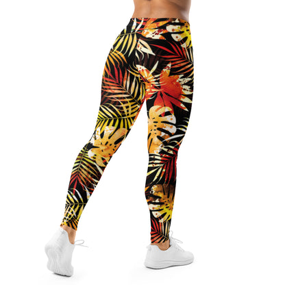 Women's full-length leggings with bold tropical leaf print in black, yellow, and red