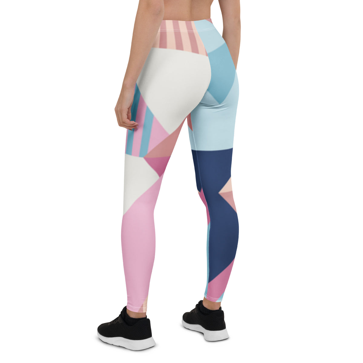 Women’s leggings back view with pastel geometric blocks and stripes, full length.