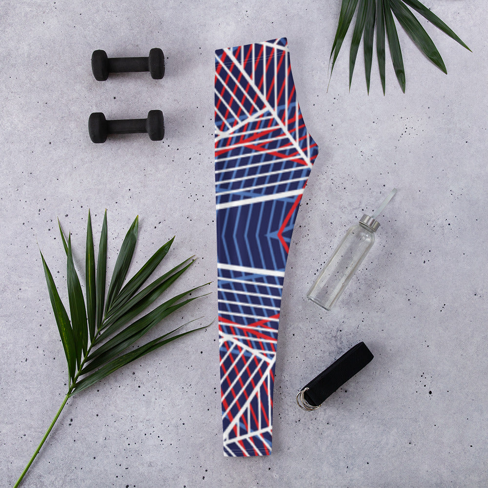 Women’s leggings folded, showing abstract geometric lines in navy, red, and white.