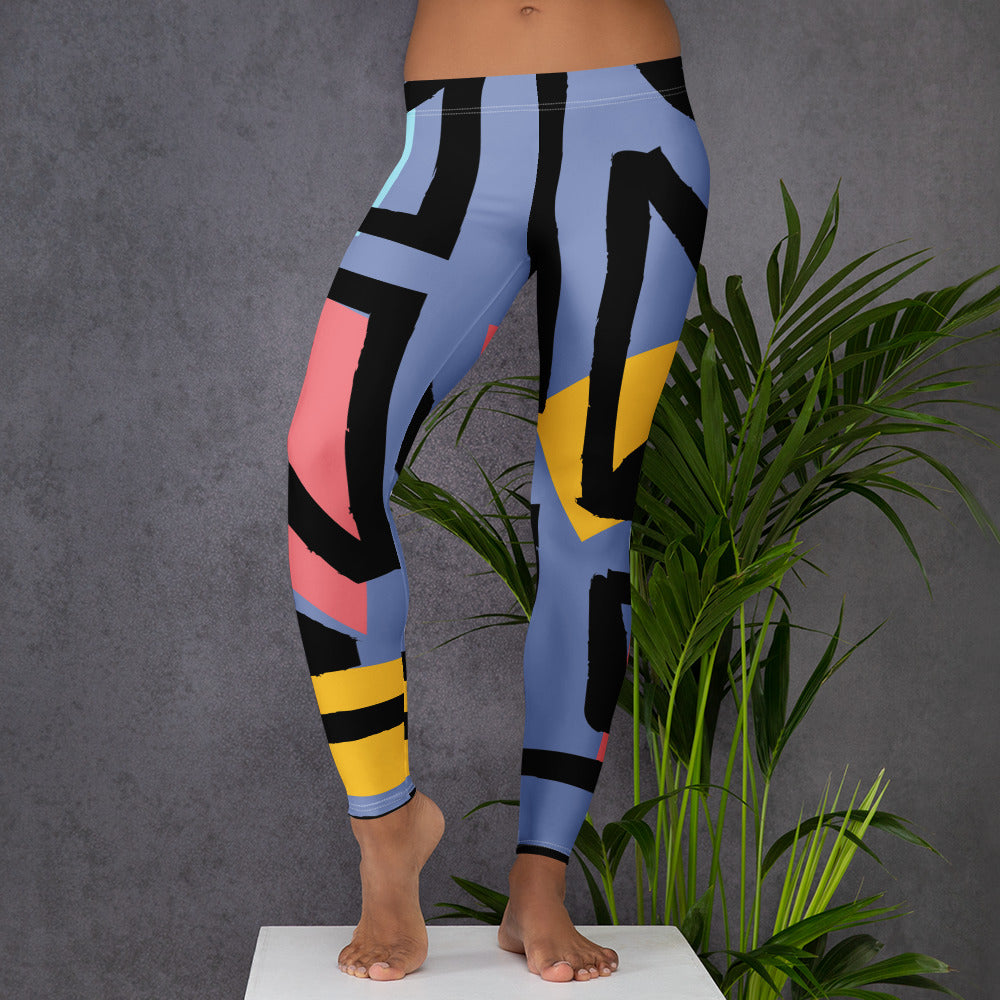 Blue geometric leggings with black, yellow, and pink stripe blocks, ankle length visible.