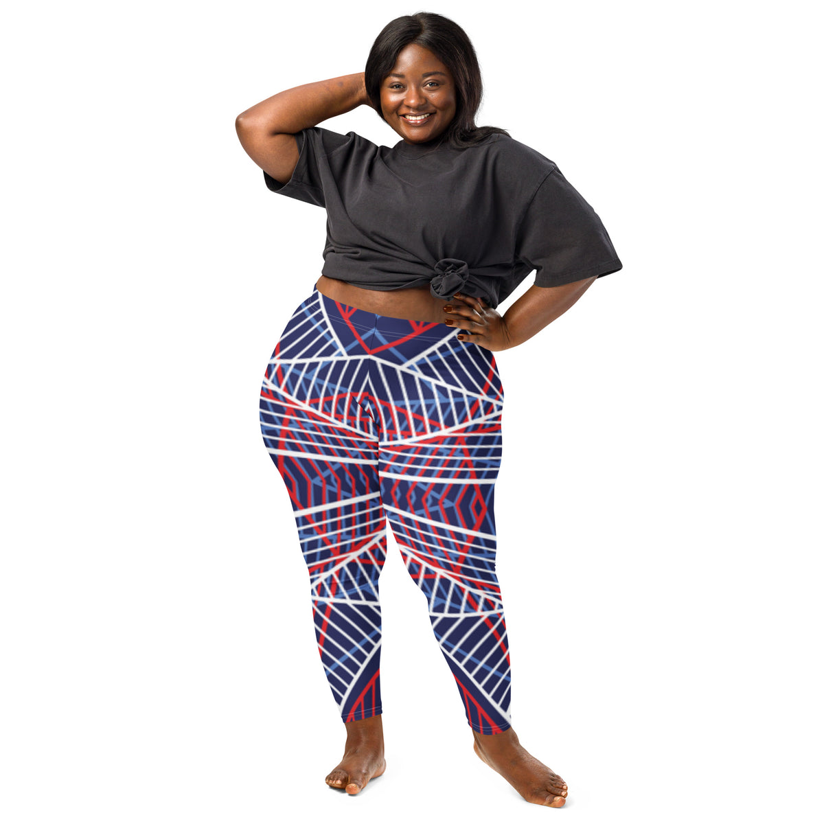 Women’s leggings with navy base and red/white abstract line pattern, full body view.