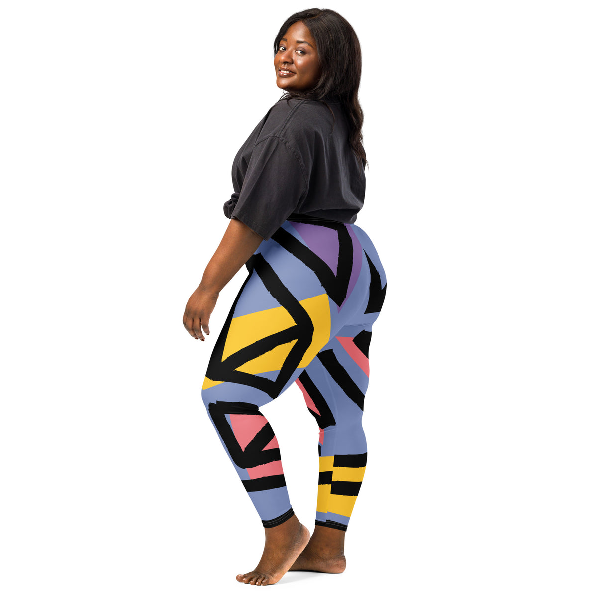 Blue geometric leggings with black, yellow, and pink stripe-like shapes, full length.
