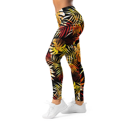 Women's leggings, side view, with black base and bright tropical leaf print