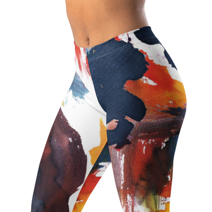 Women’s leggings showing close-up of abstract paint-splash pattern on navy fabric