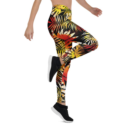 Women's tropical leaf print leggings with multicolor foliage on dark fabric