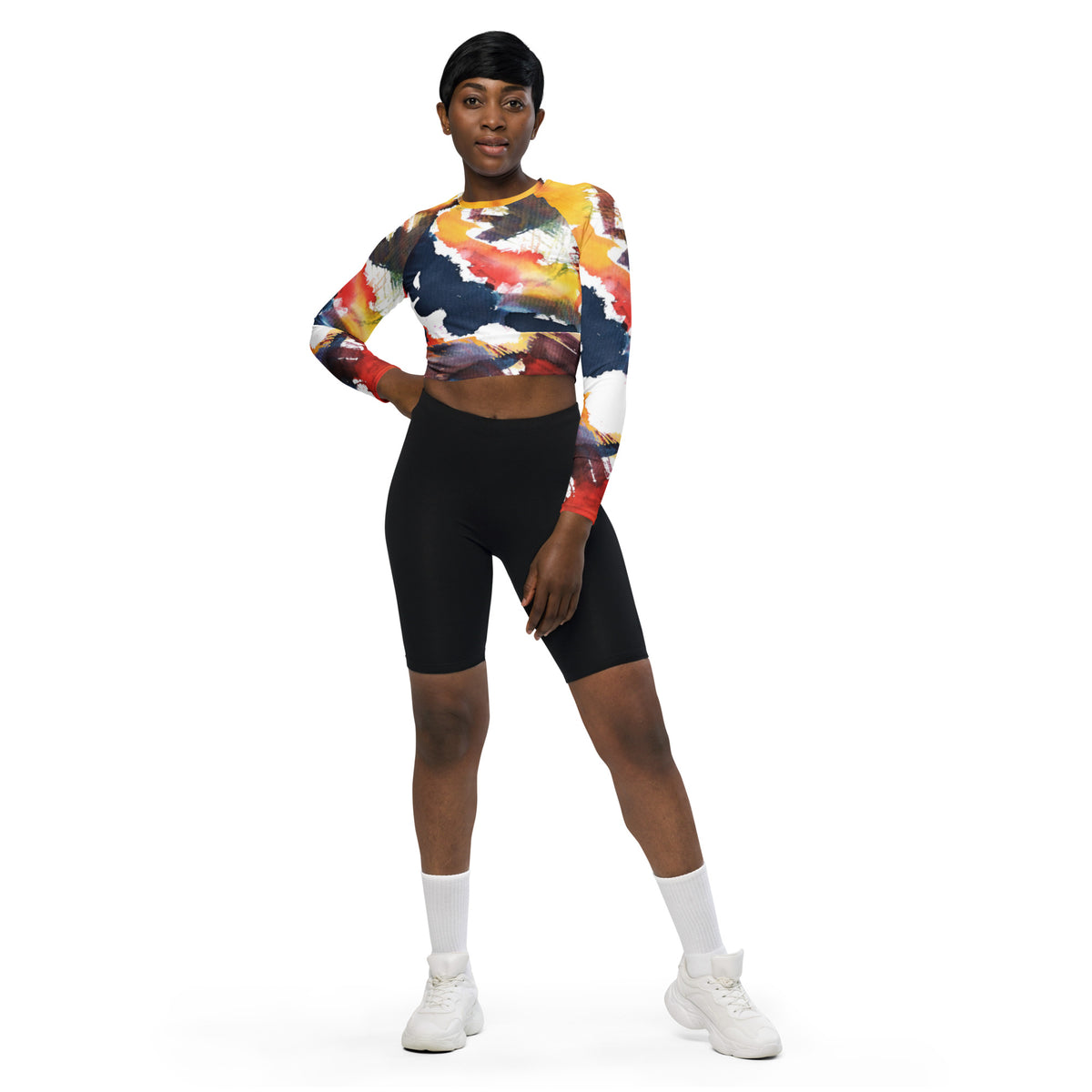 Long-sleeve crop top with abstract multicolor print, crew neck, cropped hem.