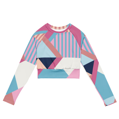 Recycled long-sleeve crop top with geometric pink, blue, and navy block print