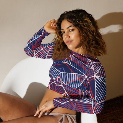 Navy long-sleeve crop top with red and white abstract geometric line print