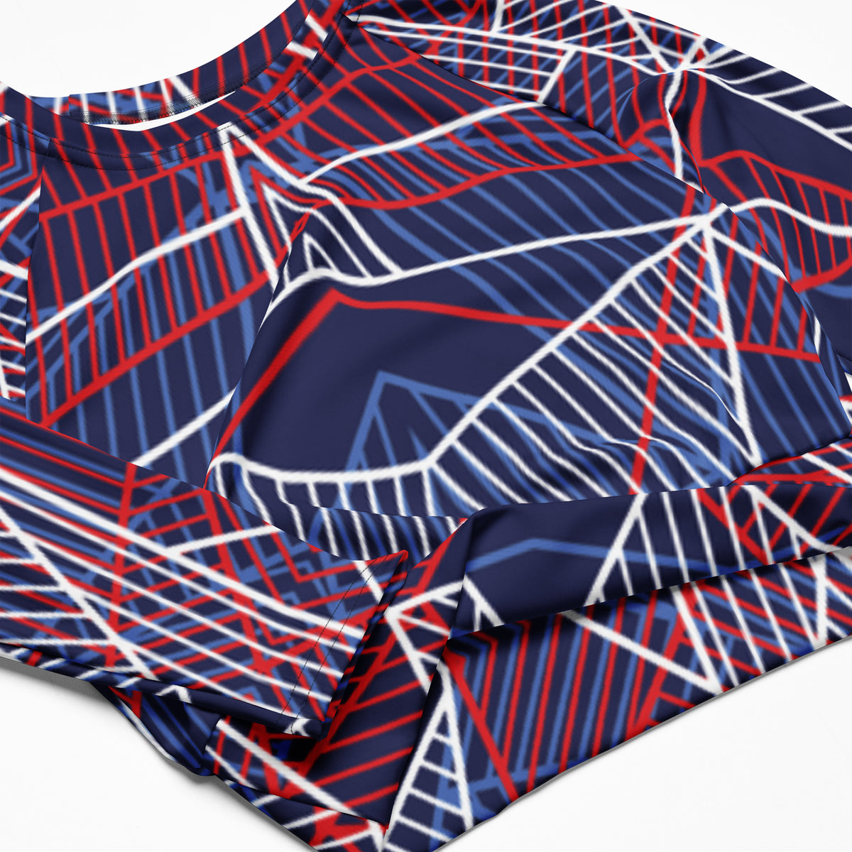 Abstract line-print long-sleeve crop top fabric in navy, red, and white