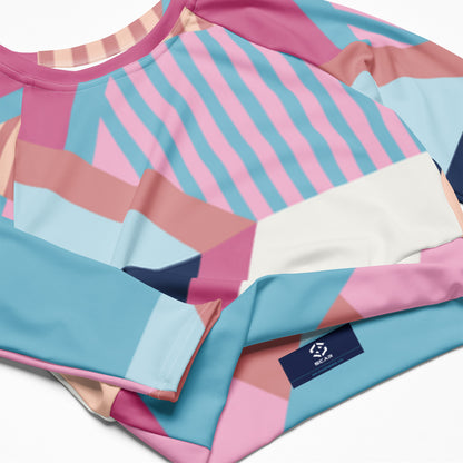 Long-sleeve crop top showing geometric pattern and crew neckline in pink and blue
