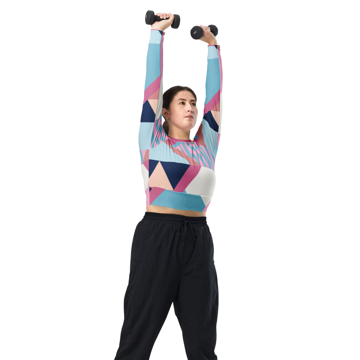 Long-sleeve crop top with pink, blue, and white geometric pattern worn with a workout