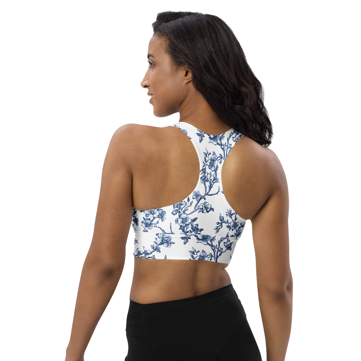 Longline sports bra with blue floral print, racerback and open back view