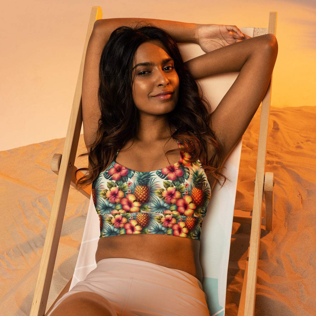Teal pineapple and hibiscus print longline sports bra with wide straps and curved neckline