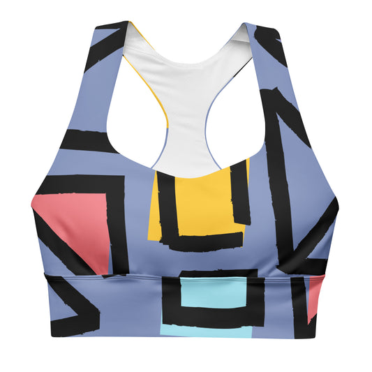 Longline sports bra with geometric print, white base and blue yellow red block pattern